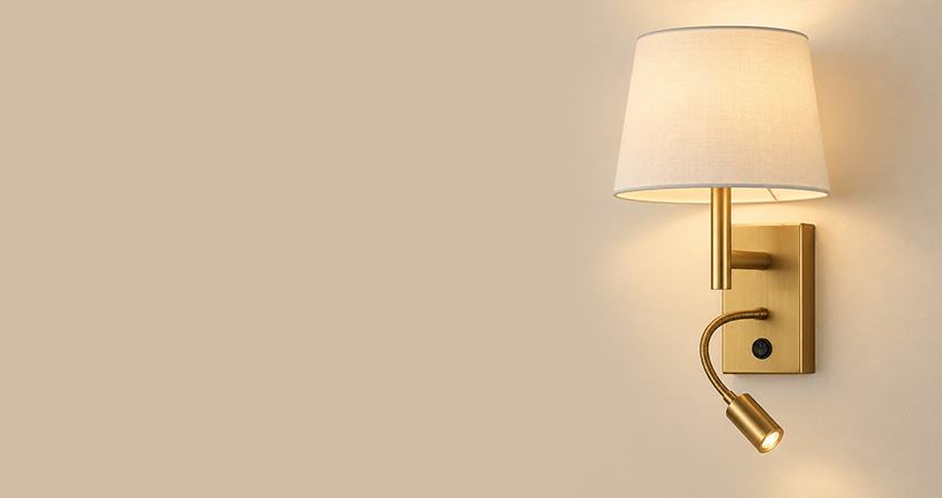 Wall-mounted reading light with fabric shade and directional spotlight