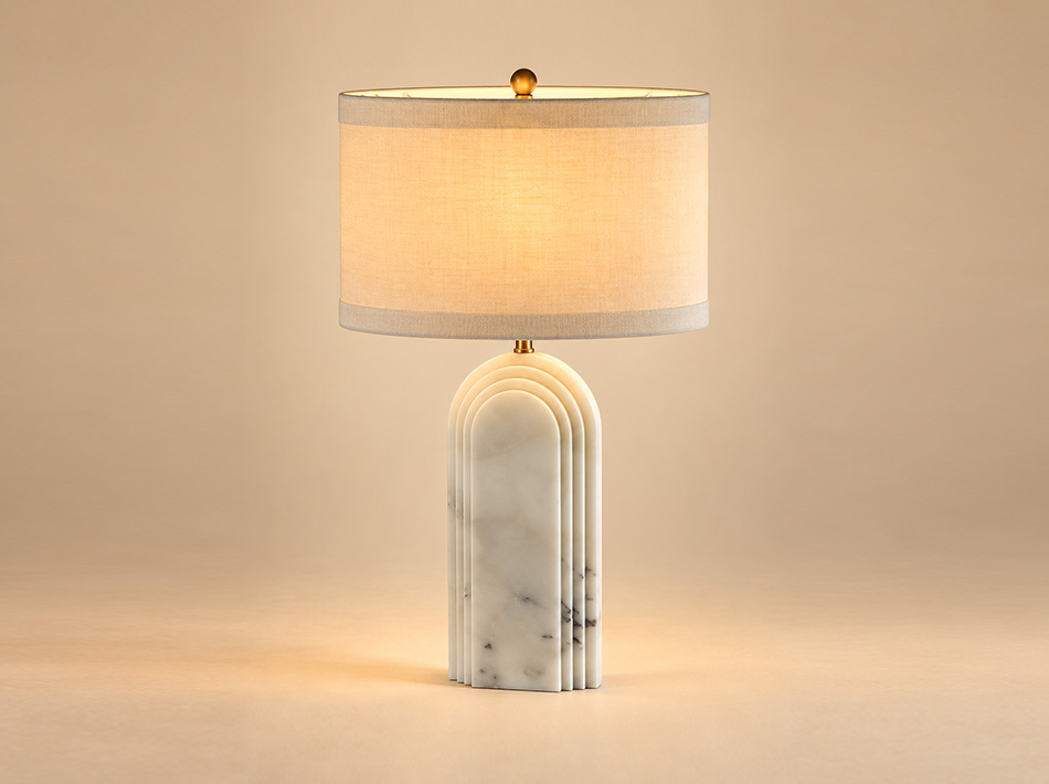Temple brushed gold table lamp with sculptural arched Crystal White marble base, subtle grey veining and oval white linen shade.