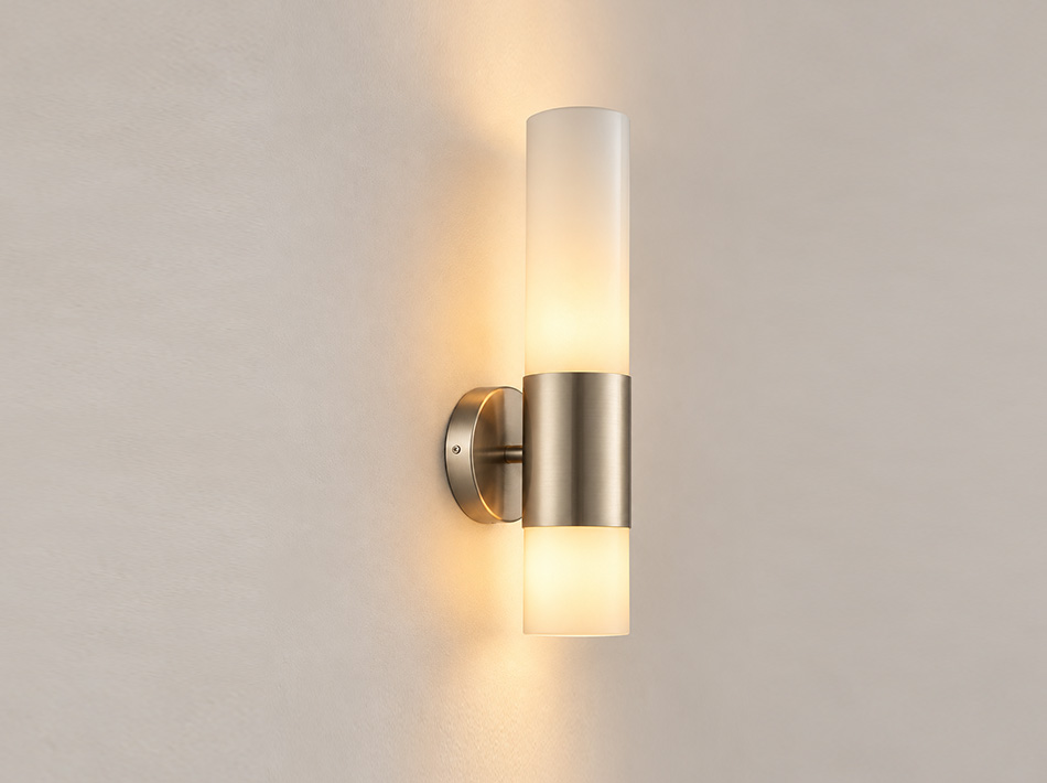 Lumi brushed silver wall sconce with vertical frosted glass shades and circular metal wall plate | Wall Lamps Dubai